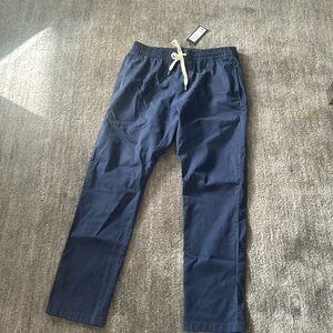 Navy Rhone men’s pants with white tie